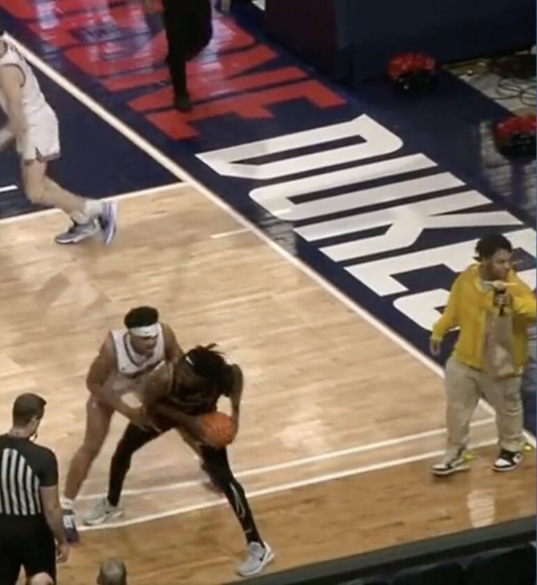 Uber Eats Delivery Guy in the court during Loyola Chicago Duquesne game