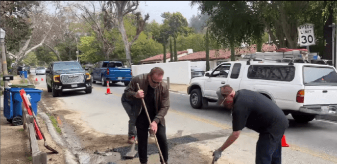 Arnold Schwarzenegger filling pothole in his LA neighborhood