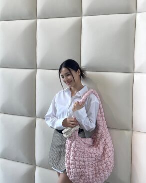 Nancy Jewel McDonie looks cute with her pink arm candy